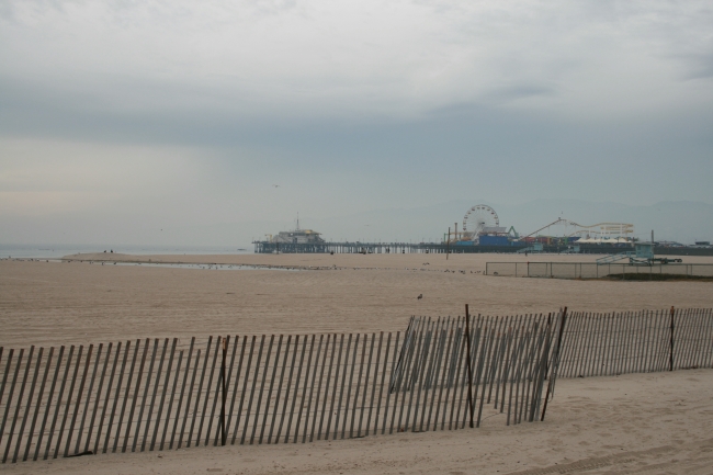 On Santa Monica beach, The ferris wheel of Santa Monica Pier in the distance