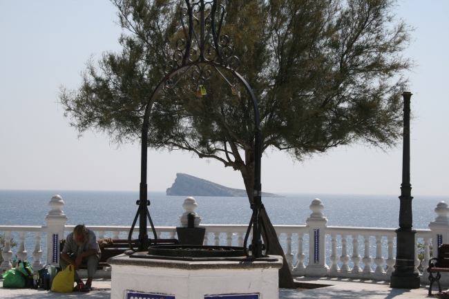 Another frame, La "Isla de Benidorm" La Isla de los Faisanes, and a poor beach bum on the bench