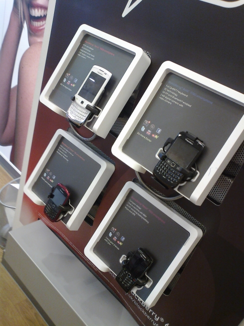 BlackBerrys and other mobiles on display, 