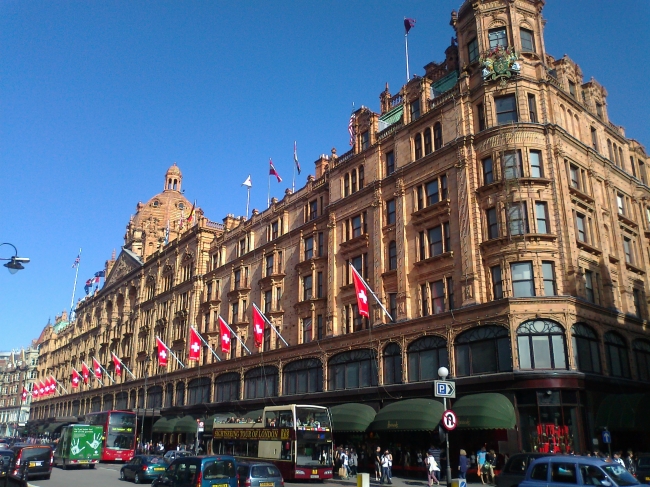 Harrods with Swiss flags drench in beautiful sunlight, 