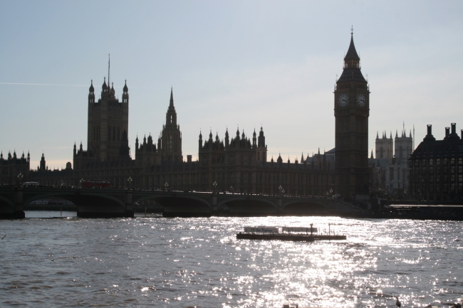 Big Ben, Houses of Parliament and the Sun glistening on the river Thames, 