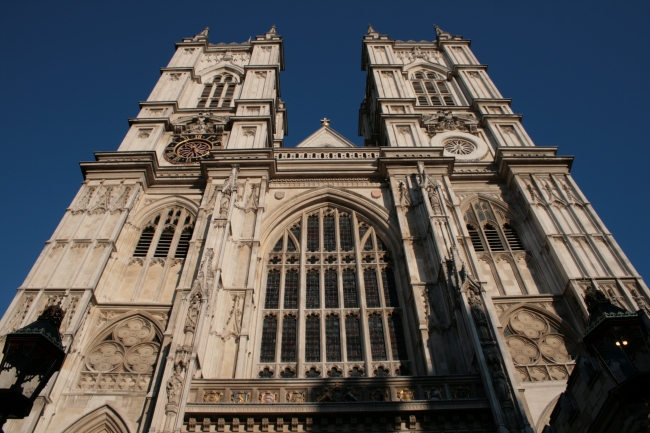 Frontal view of Westminster Abbey's two towers, the glass window above the entrance, 