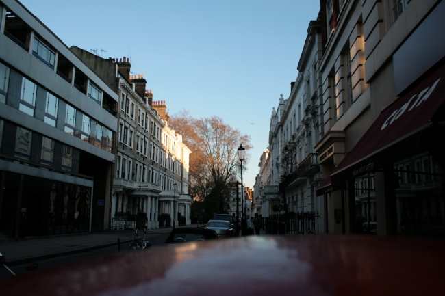 Kensington streets, with some white houses and their signature "upper class" doorways, Costa Coffee not far...