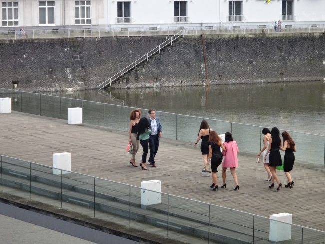 Girls on the go, a group of party-bound girls, striding along