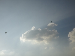 Two balloons and a cloud