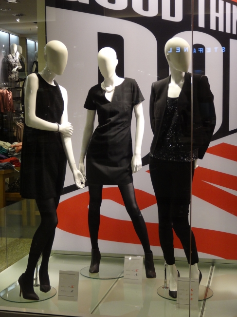 Some mannequins, wearning the little black dress, at "we", I think