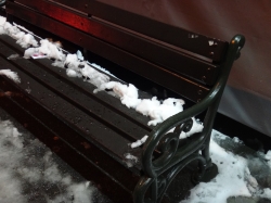 Snow covered bench