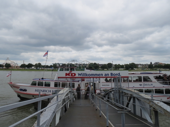 Heinrich Heine tour boat, on river Rhine, note the fairground in the far back