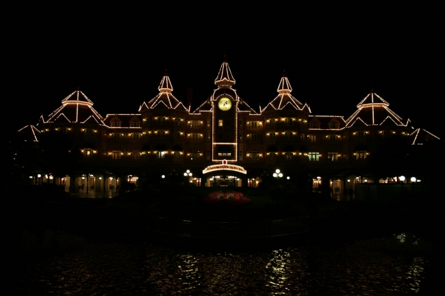 Disneyland Paris main entry and Disneyland Hotel, at night