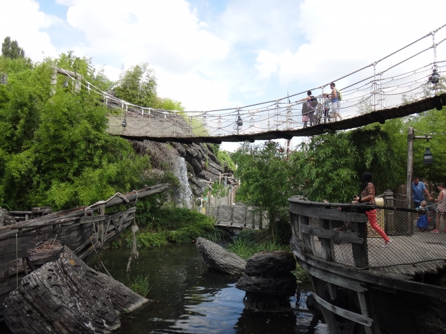 Skull island suspension bridge, with waterfall in the background