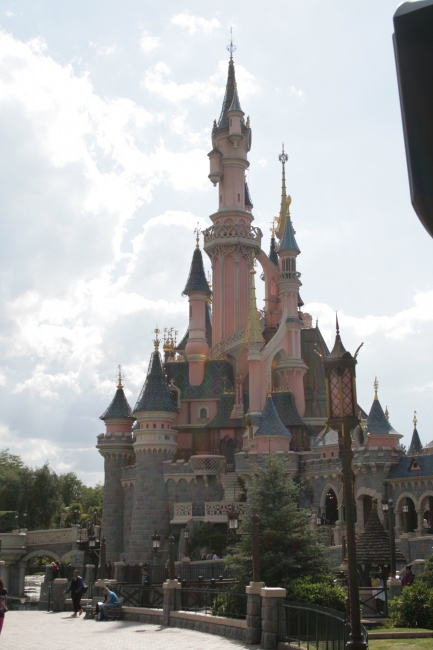 Le Château de la Belle au Bois Dormant, The Castle of The Sleeping Beauty, as seen from Fantasyland gate, the well on the far right is where you usually can be photographed with disney cast members...