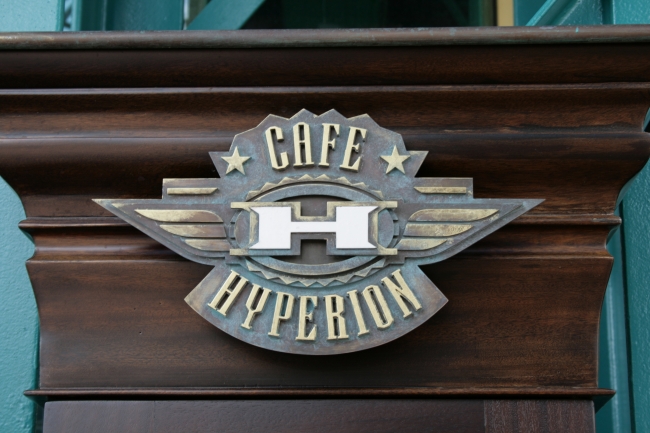 Café Hyperion logo sign, sharing space with Videopolis in Discoveryland