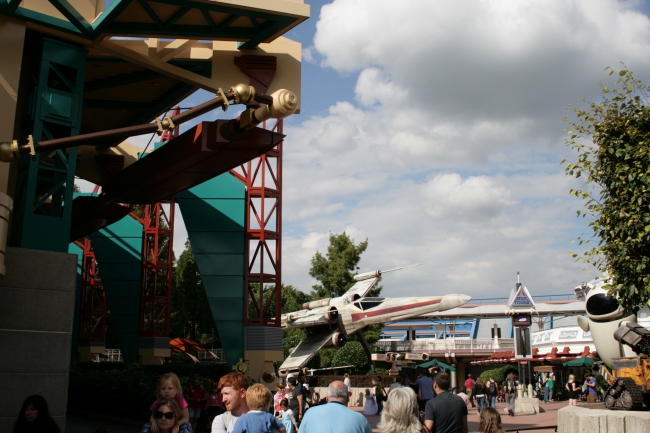 X-Wing fighter (and Videopolis structure), the X-Wing, now mainly associated with Jedi Academy, formerly advertising star Tours, which is seen in the background