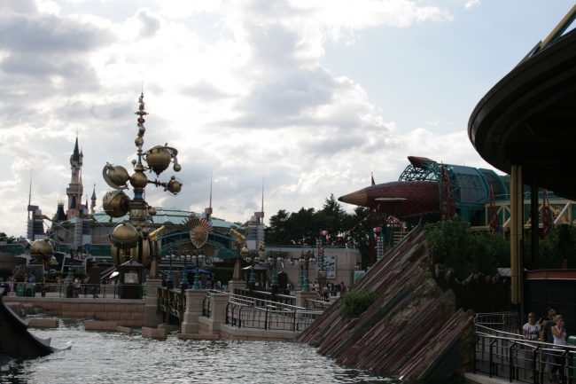 Overlooking the nautilus pond at Discoveryland, Orbitron, Hyperion airship, and a section of Space Mountain