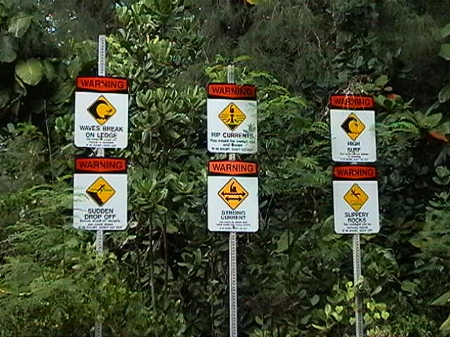 Warning signs, Kauai, it seems to be dangerous, having fun in the surf, here...