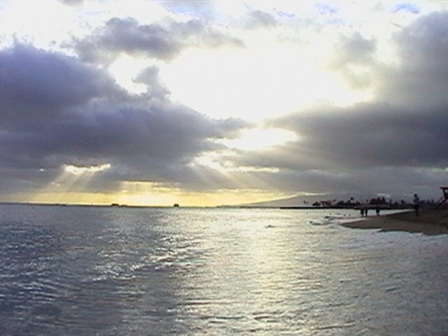 Sunset over the marina, seen from Fort De Russy beach park